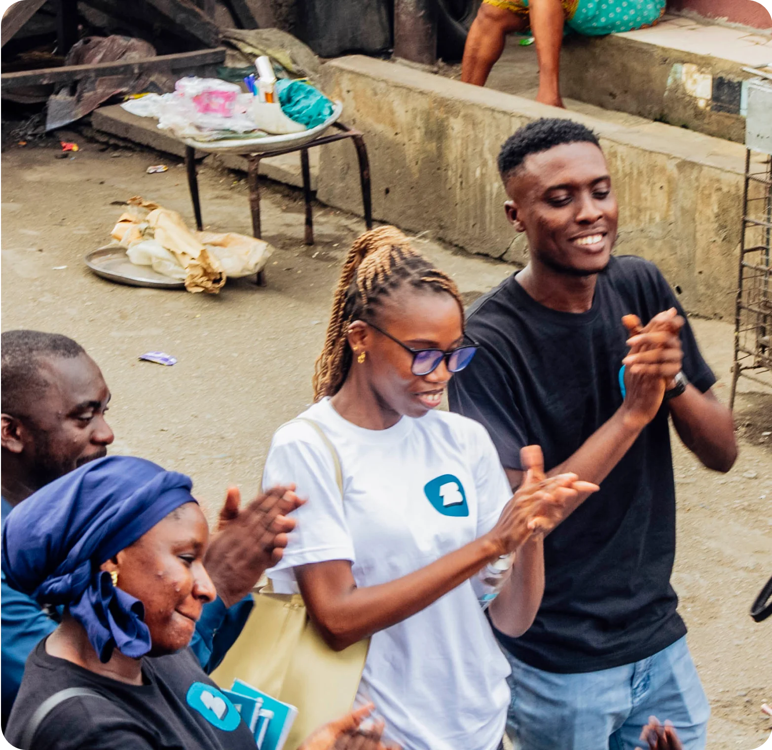 a group of people clapping