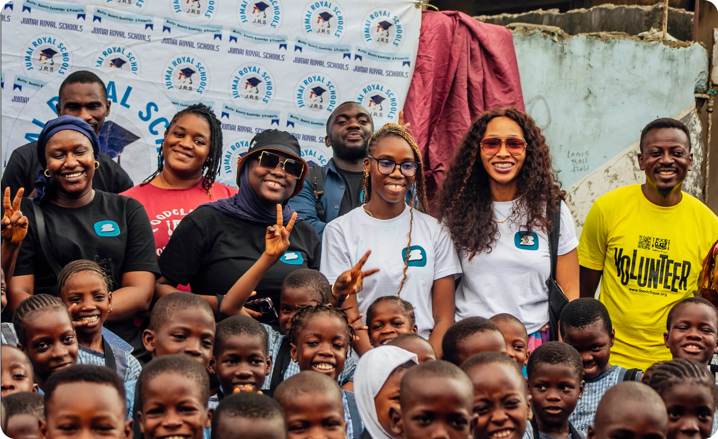 a group of people smiling and posing for a picture