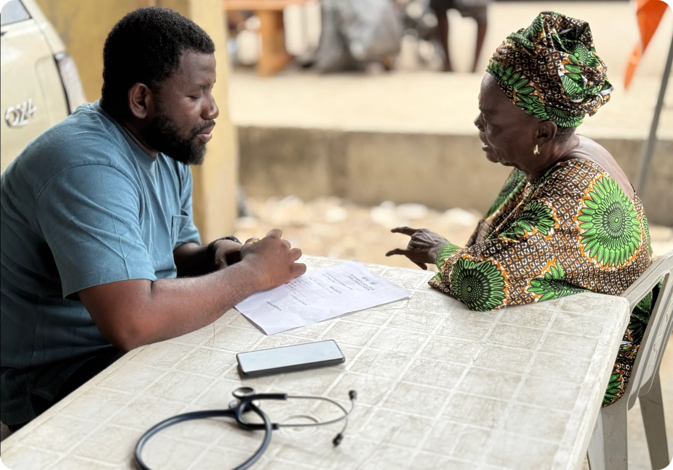 an old woman consulting a male doctor