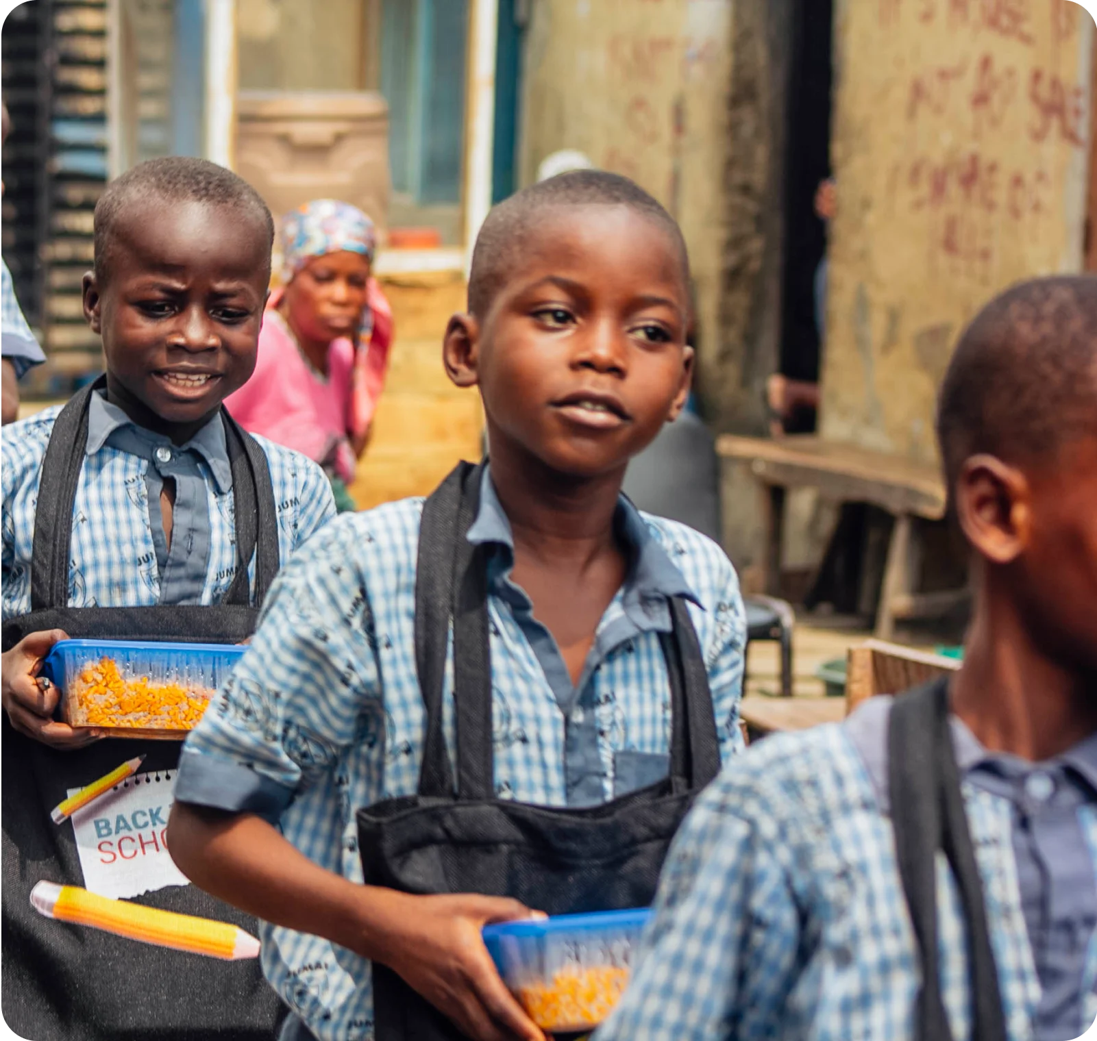 young students standing in line with food in their hand